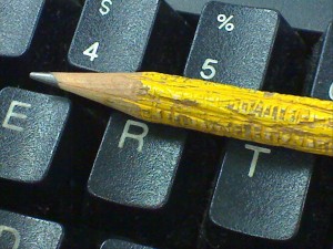 Chewed up pencil and computer keyboard.